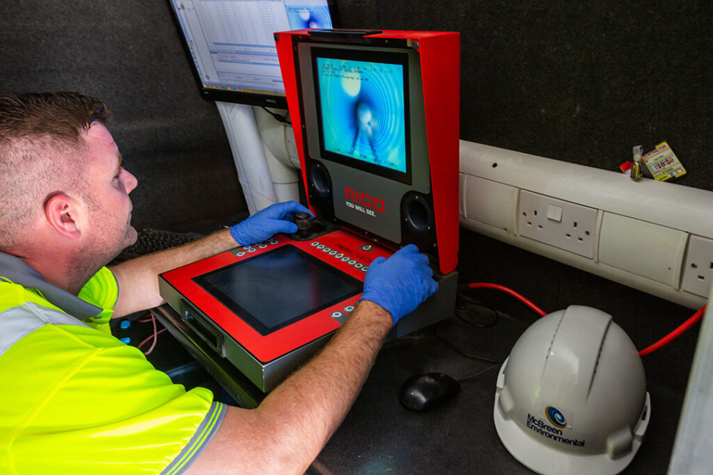 McBreen Environmental CCTV camera operator looking at screen to assess the CCTV Drain Survey inspection | McBreen Environmental Cavan, Roscommon, Cavan, Cork, Louth | Nationwide Waste v & Drainage Industry Specialists